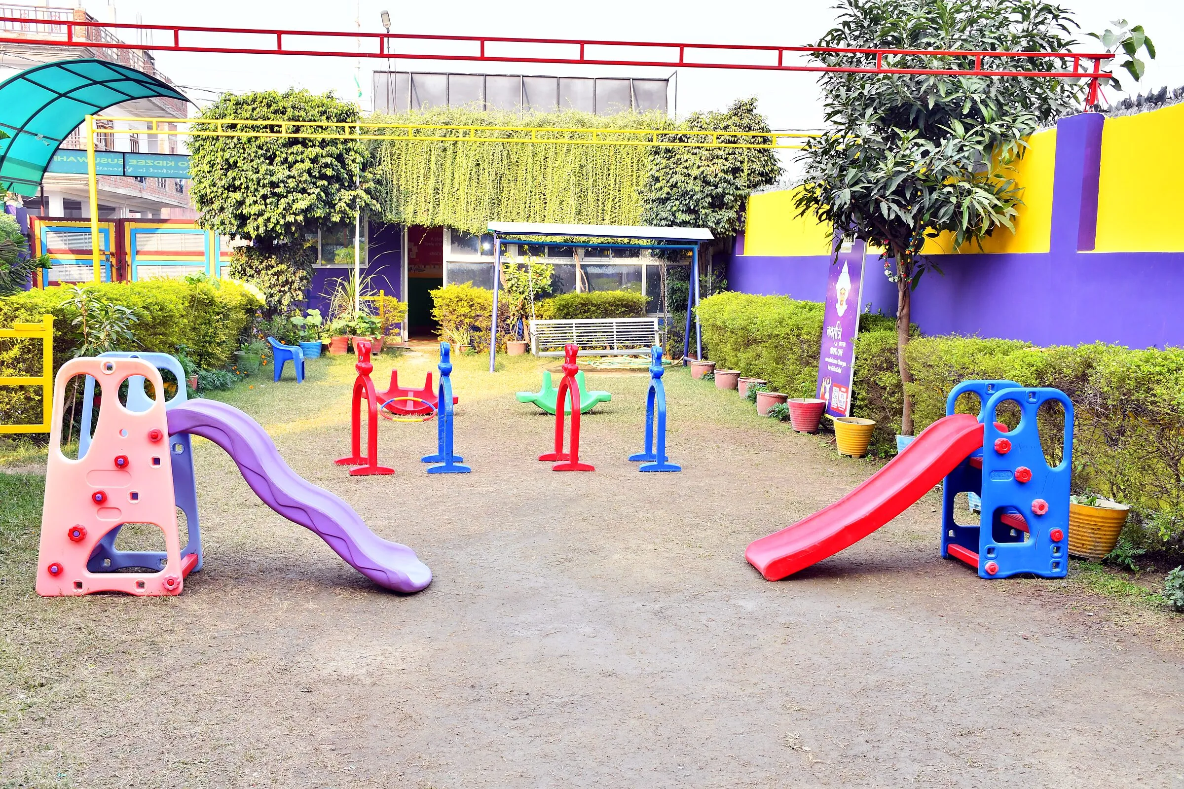 The playground, with slides, see-saws and swings